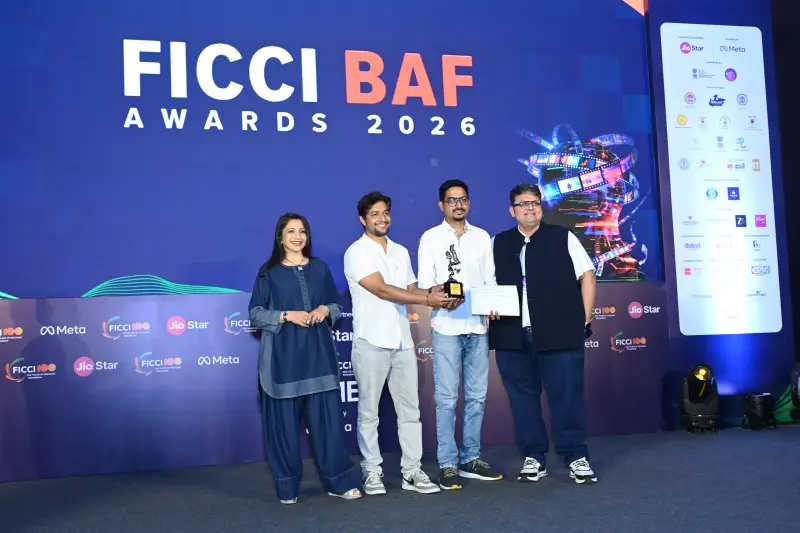 A group of winners and presenters with the trophy at the FICCI BAF Awards 2026.