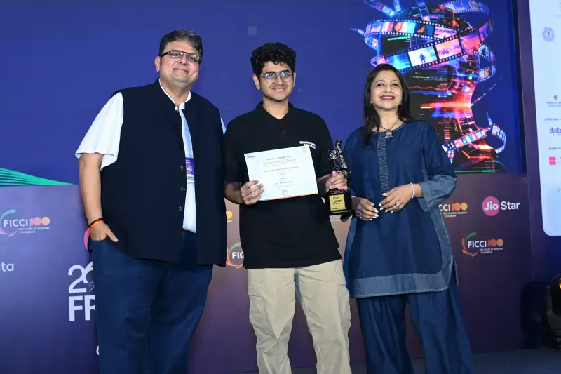 A student winner poses with his trophy, certificate and the presenters at the FICCI BAF Awards 2026.