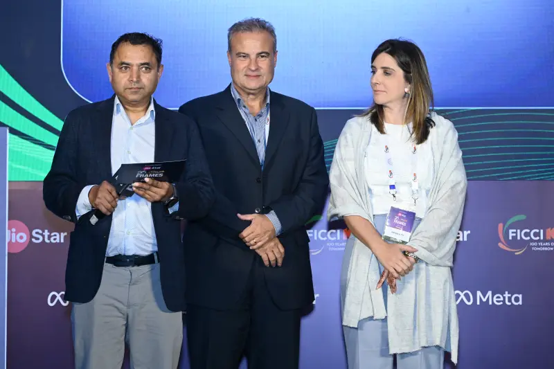 Three stand together with an award certificate at the FICCI BAF Awards 2026.