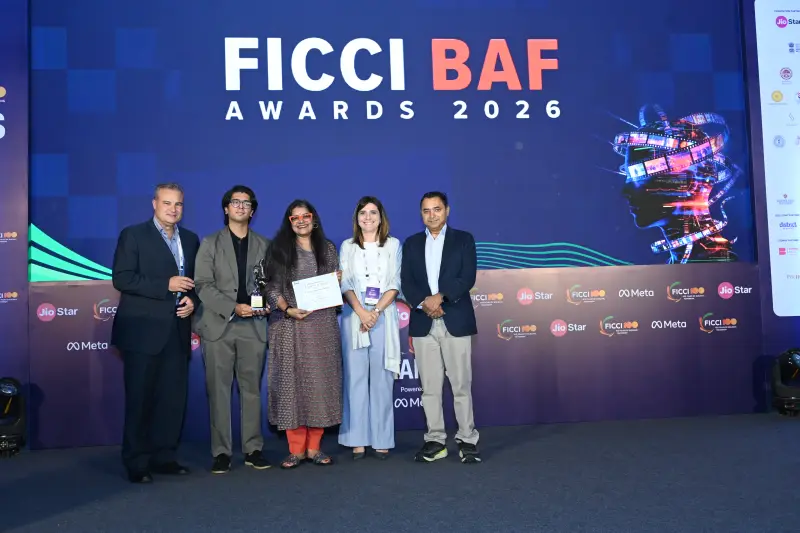 A winning team receives their certificate at the FICCI BAF Awards 2026.