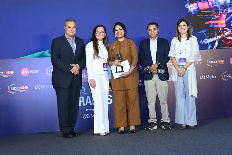 A winning team holds their trophies at the FICCI BAF Awards 2026.